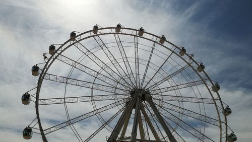 Low angle view of ferris wheel against sky