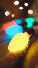 Close-up of illuminated lights on table