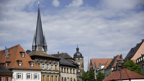 View of buildings against cloudy sky