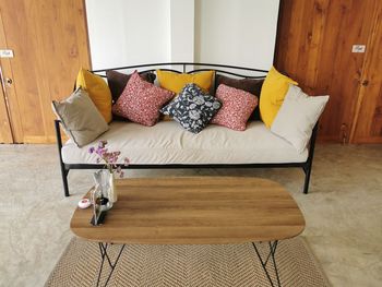 Table and chairs on bed at home