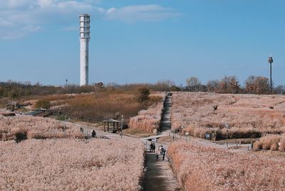 Tower on field against sky