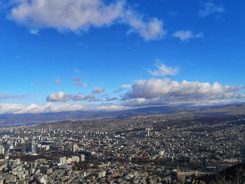 High angle view of townscape against blue sky