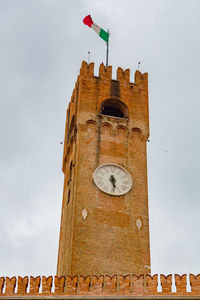 Low angle view of clock tower against sky