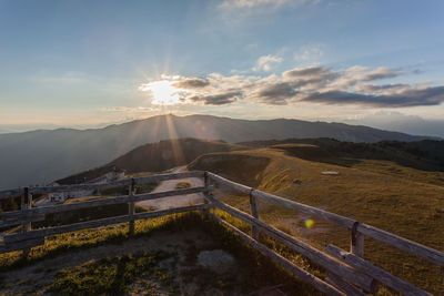 Scenic view of mountains against sky during sunset