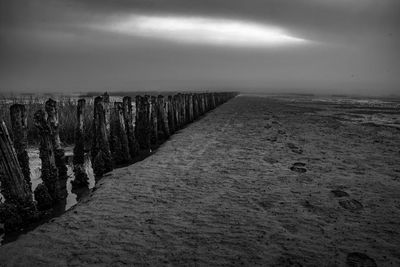 Scenic view of beach against sky during winter