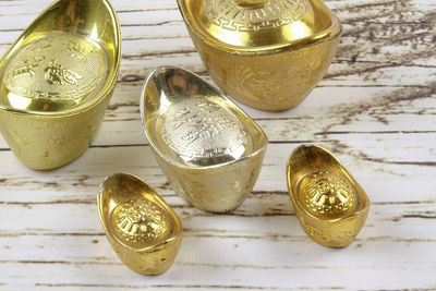 Close-up of ingot feng shui on table