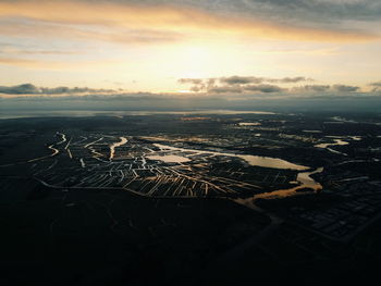 Aerial view of landscape against sky during sunset