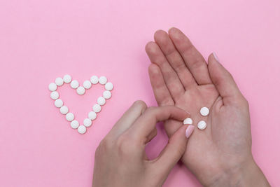 Close-up of woman hand holding heart shape