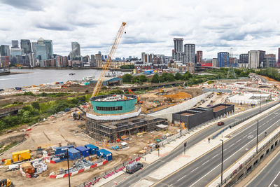 Major riverfront infrastructure construction site in london with cranes. london, uk, 27 may 2024