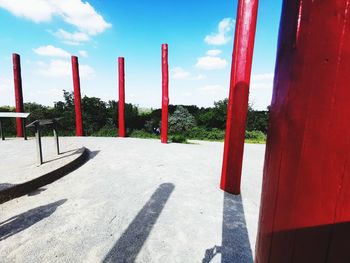 View of empty park against sky on sunny day