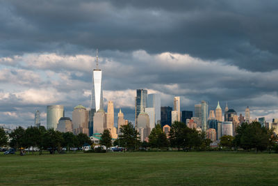 View of modern buildings against cloudy sky