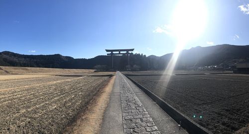 Scenic view of landscape against blue sky