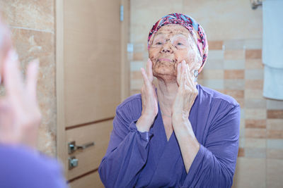 Portrait of young woman wearing mask