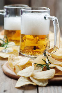 Close-up of beer glass on table