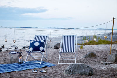 Two beach chairs on beach