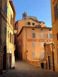 Narrow alley amidst buildings in town