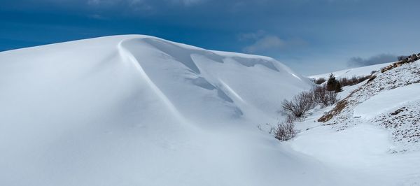 Snowcapped mountain against sky