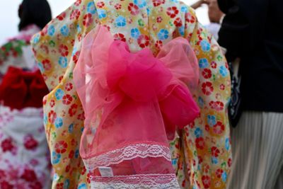 Rear view of people in traditional clothing