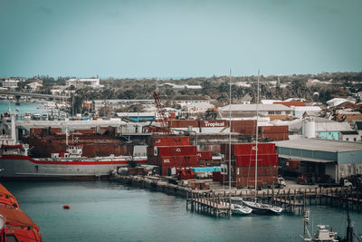 Boats moored at harbor