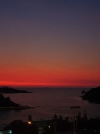 Scenic view of sea against romantic sky at sunset