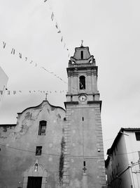 Low angle view of clock tower against sky