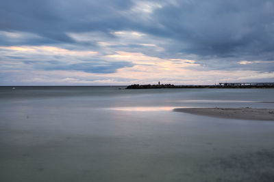 Scenic view of sea against sky at sunset