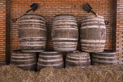 Stack of barrels against wall