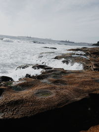 View of calm beach against sky