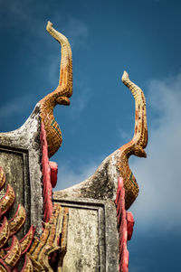 Low angle view of statue against sky