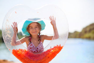 Portrait of smiling girl in water