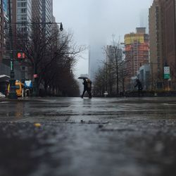 People walking on street on rainy day