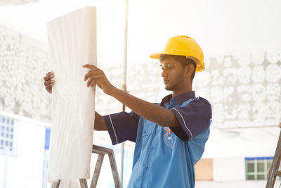 Man working with umbrella