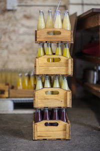 Bottles of juice in wooden boxes ready to be shipped