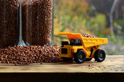 Close-up of toy truck with food on table