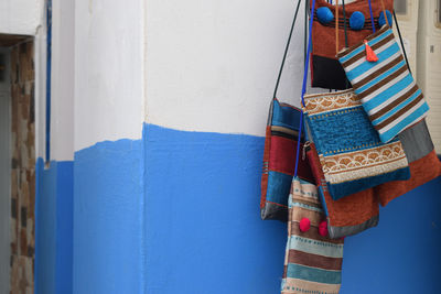 Traditional  woven handicrafts handmade patterns  colorful shoulder bags with blue wall
