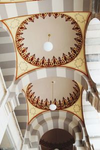 Low angle view of illuminated ceiling