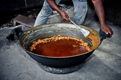 Midsection of man preparing food