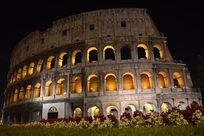 Low angle view of historical building at night