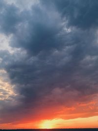 Low angle view of dramatic sky during sunset