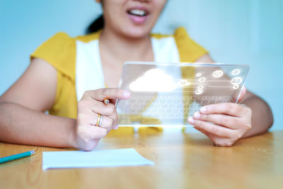 Close-up of young woman using mobile phone