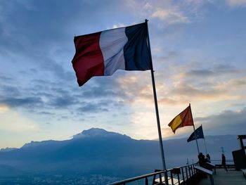 Low angle view of flag against sky