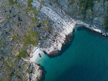 High angle view of rocks and sea