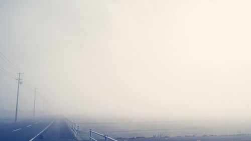 Road passing through foggy weather