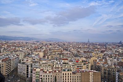 High angle view of city against cloudy sky