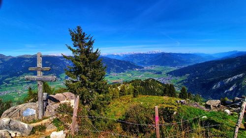 Scenic view of mountains against blue sky