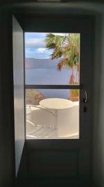 Scenic view of sea seen through home window