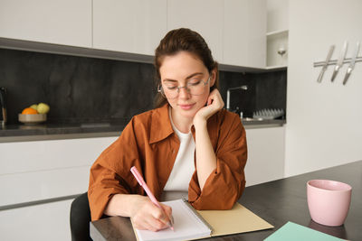 Young businesswoman working at office