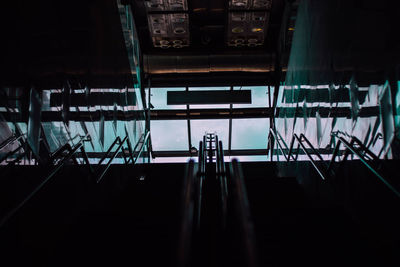 High angle view of people standing on escalator