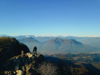 Scenic view of mountains against clear blue sky