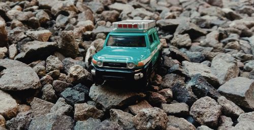 High angle view of toy car on rocks